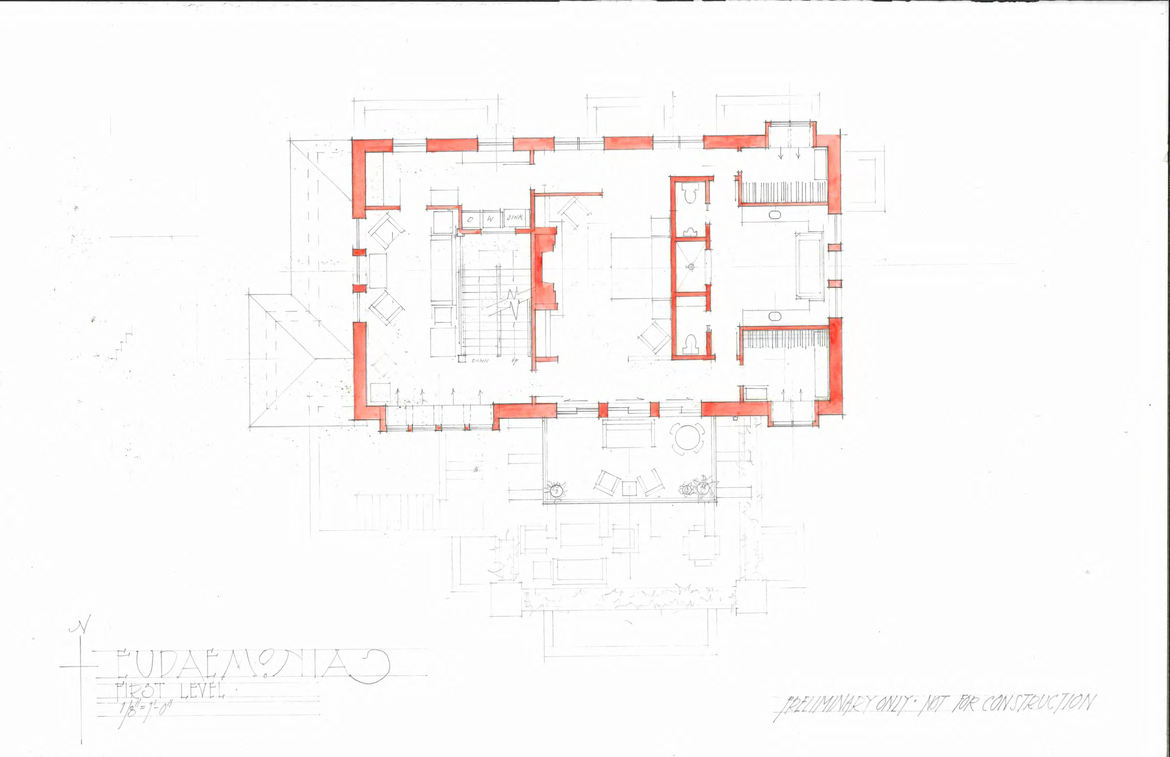 First level floor plan drawn in graphite with the structural walls washed in red, showing stairs, a central hall, bathrooms, and a covered terrace with a dining table to the south.